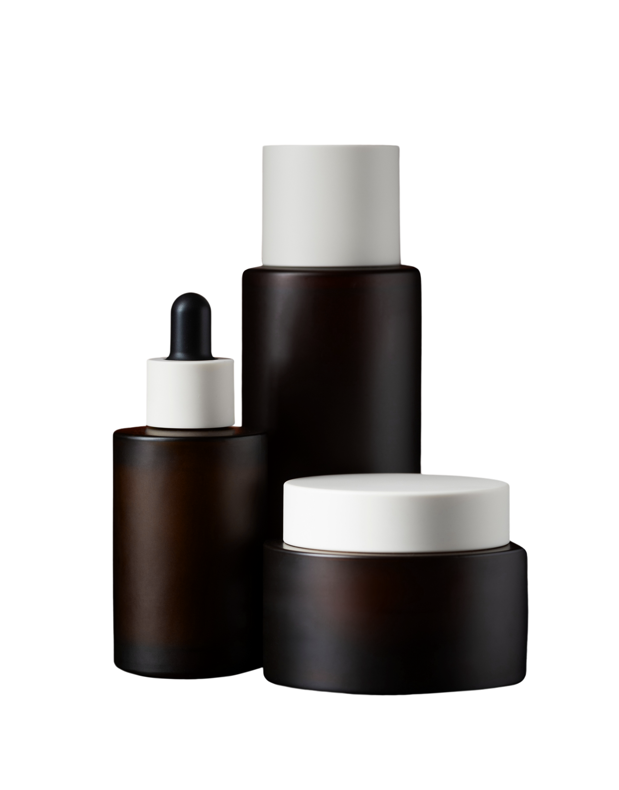 Dark brown cosmetic packaging set with a dropper bottle, tall bottle and cream jar, all with white caps.