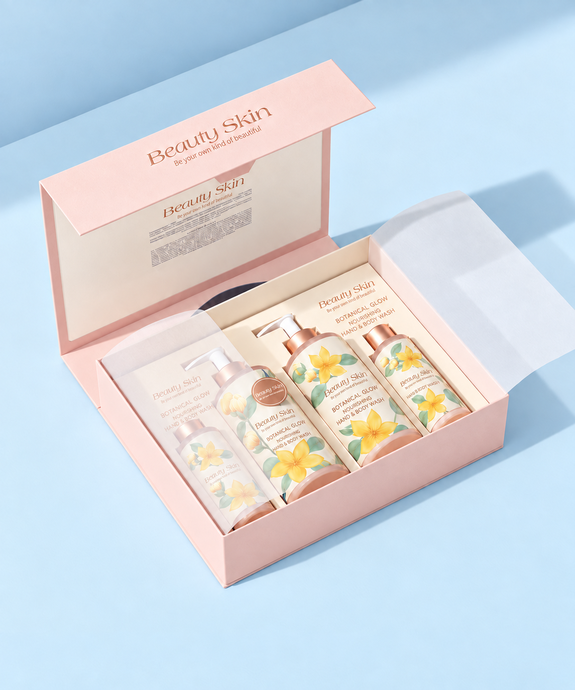 Open pink rigid beauty product gift box with four floral-labelled body care bottles and a fitted product insert.