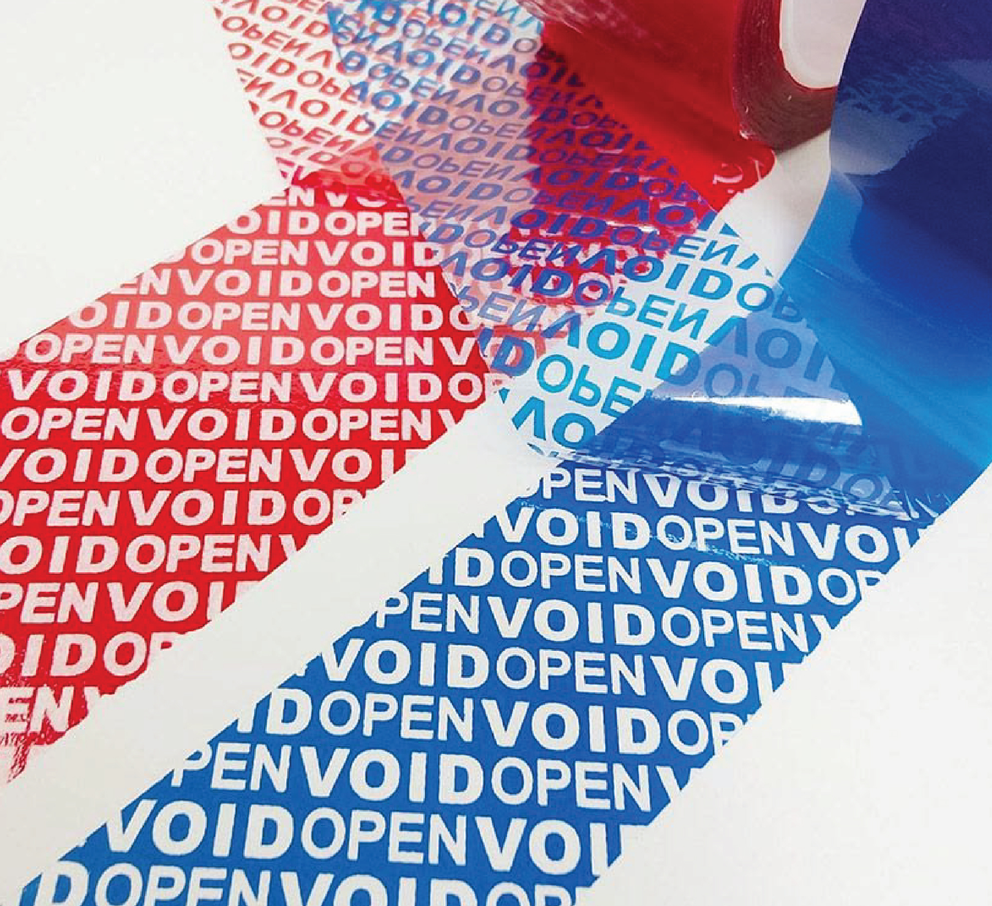 Red and blue security labels being peeled back to reveal repeating VOID OPEN patterns on a white surface.